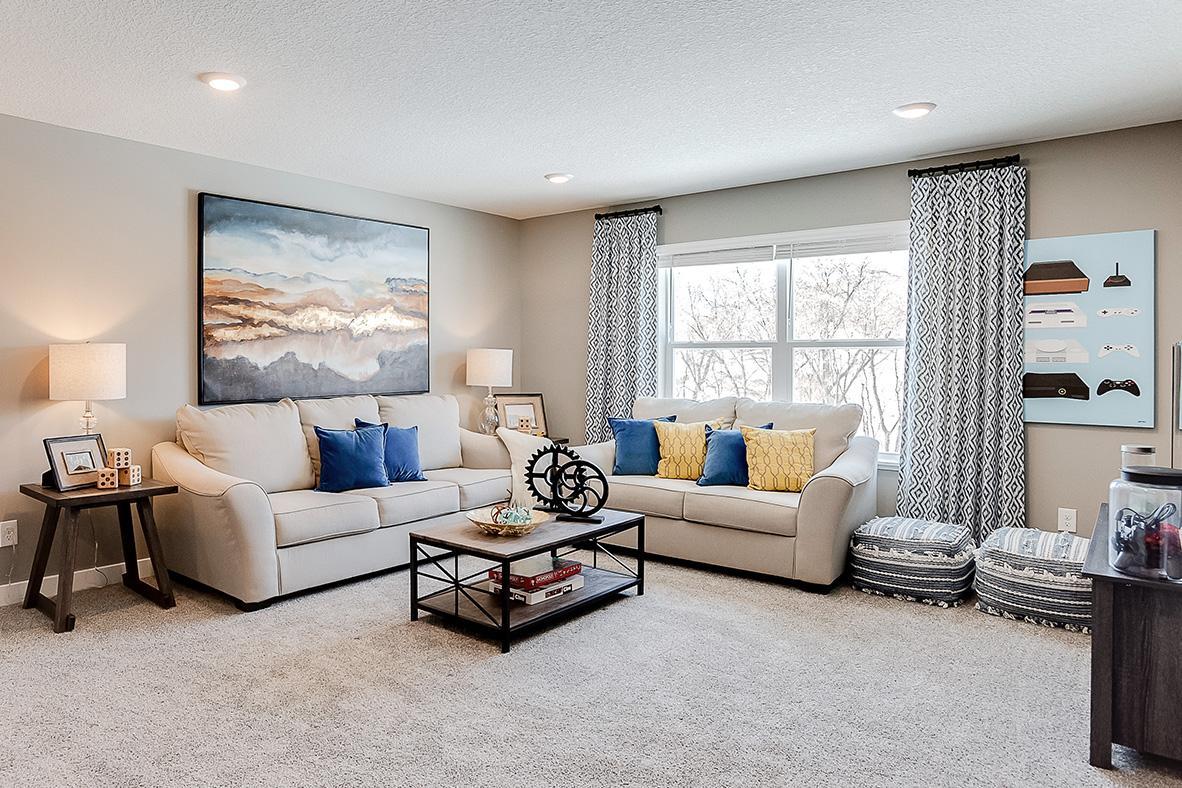 Once upstairs, a focal point offered is this huge loft space. Sure to become a family favorite hangout spot, this room is central located from each of the home's four bedrooms! Photo of model home, color & options may vary.