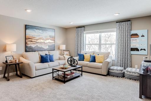 Once upstairs, a focal point offered is this huge loft space. Sure to become a family favorite hangout spot, this room is central located from each of the home's four bedrooms! Photo of model home, color & options may vary.