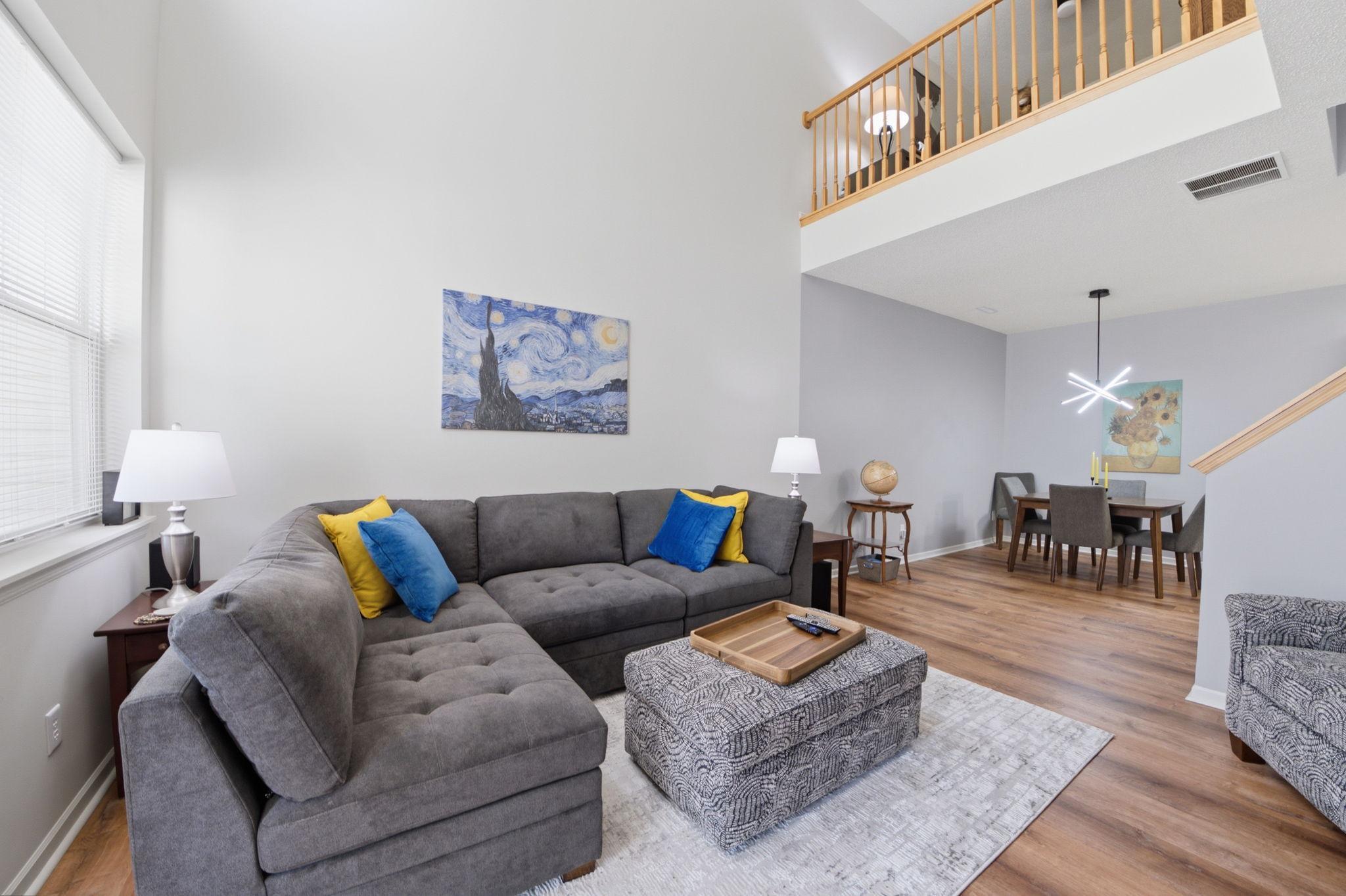 Living room with loft above