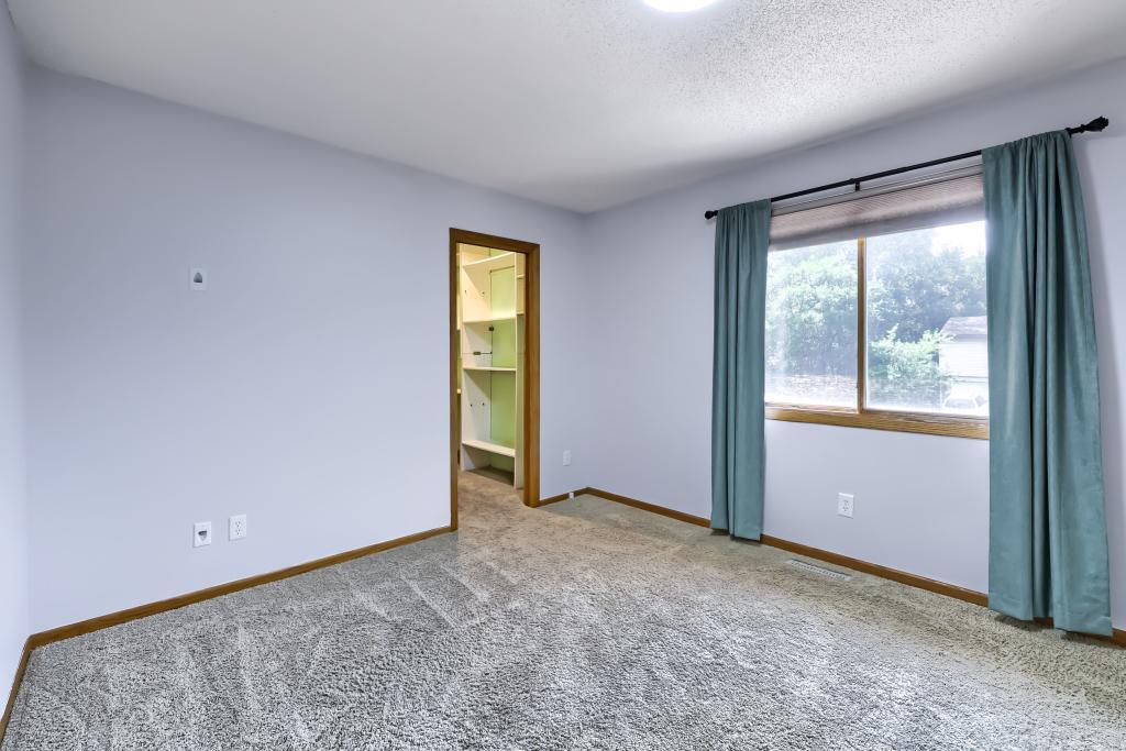 3rd upper-level bedroom. This one has a walk-in closet