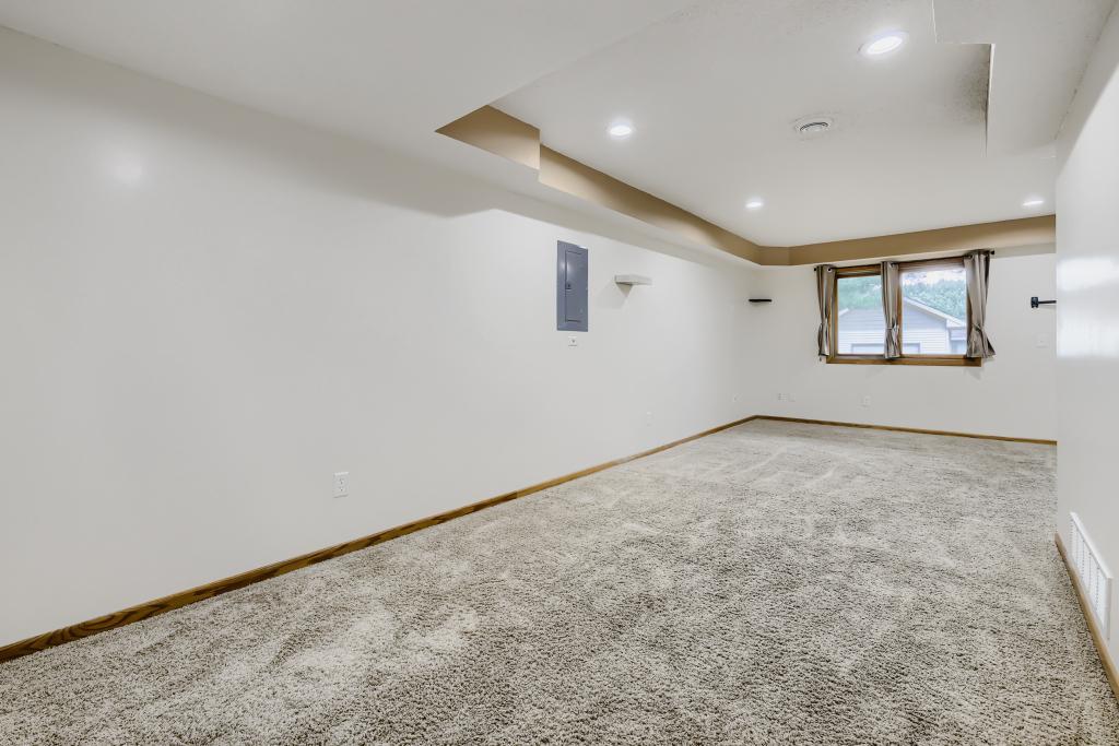 Another view of the L-shaped lower-level family room