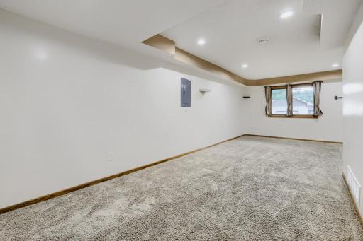 Another view of the L-shaped lower-level family room