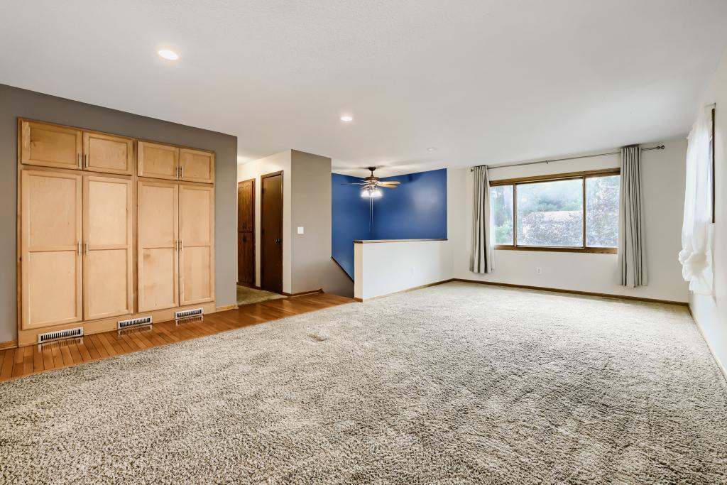 Living room showing cupboard space for kitchen or storage for games & family fun