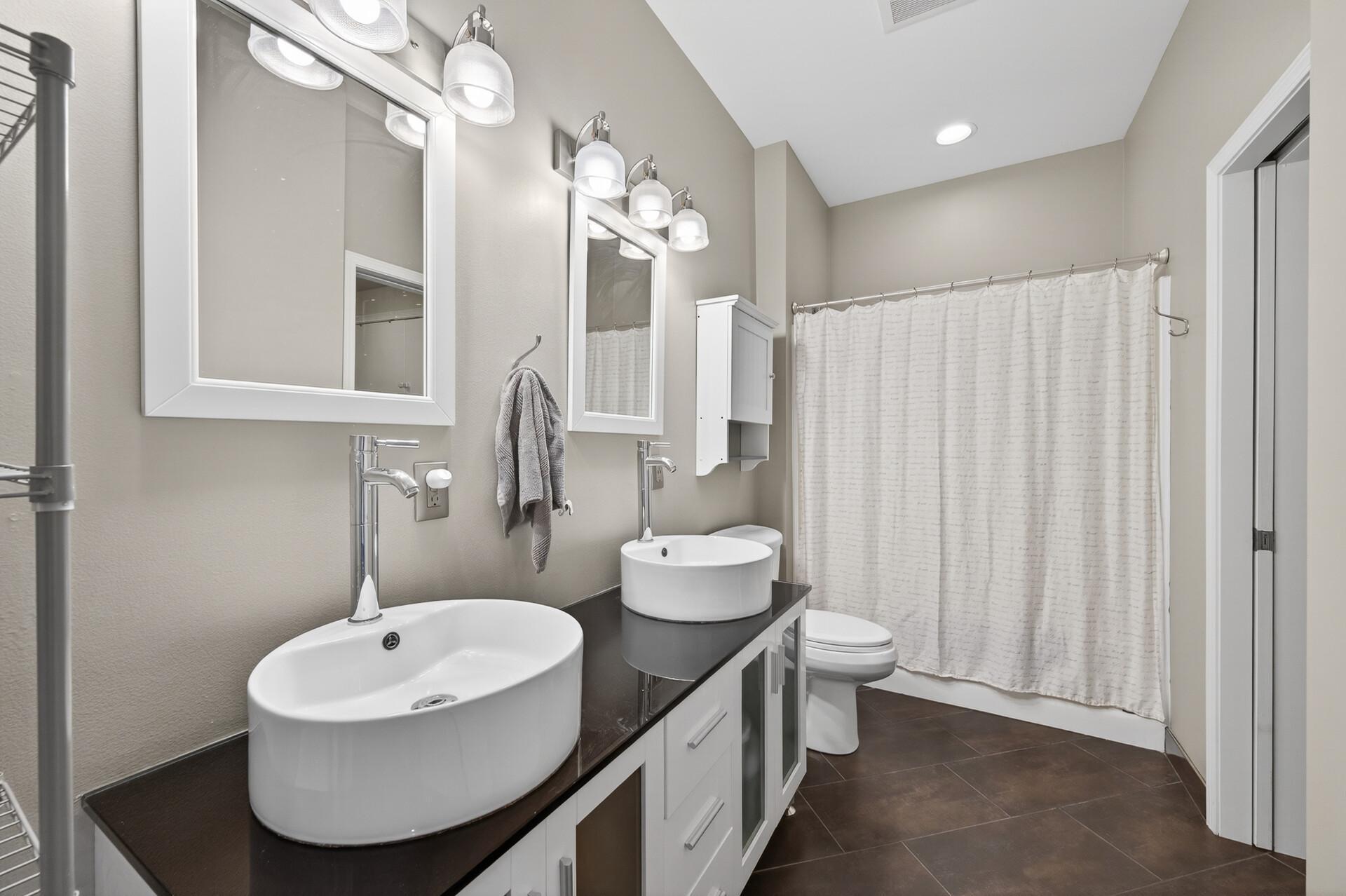 Tastefully appointment bath with dual vanity.