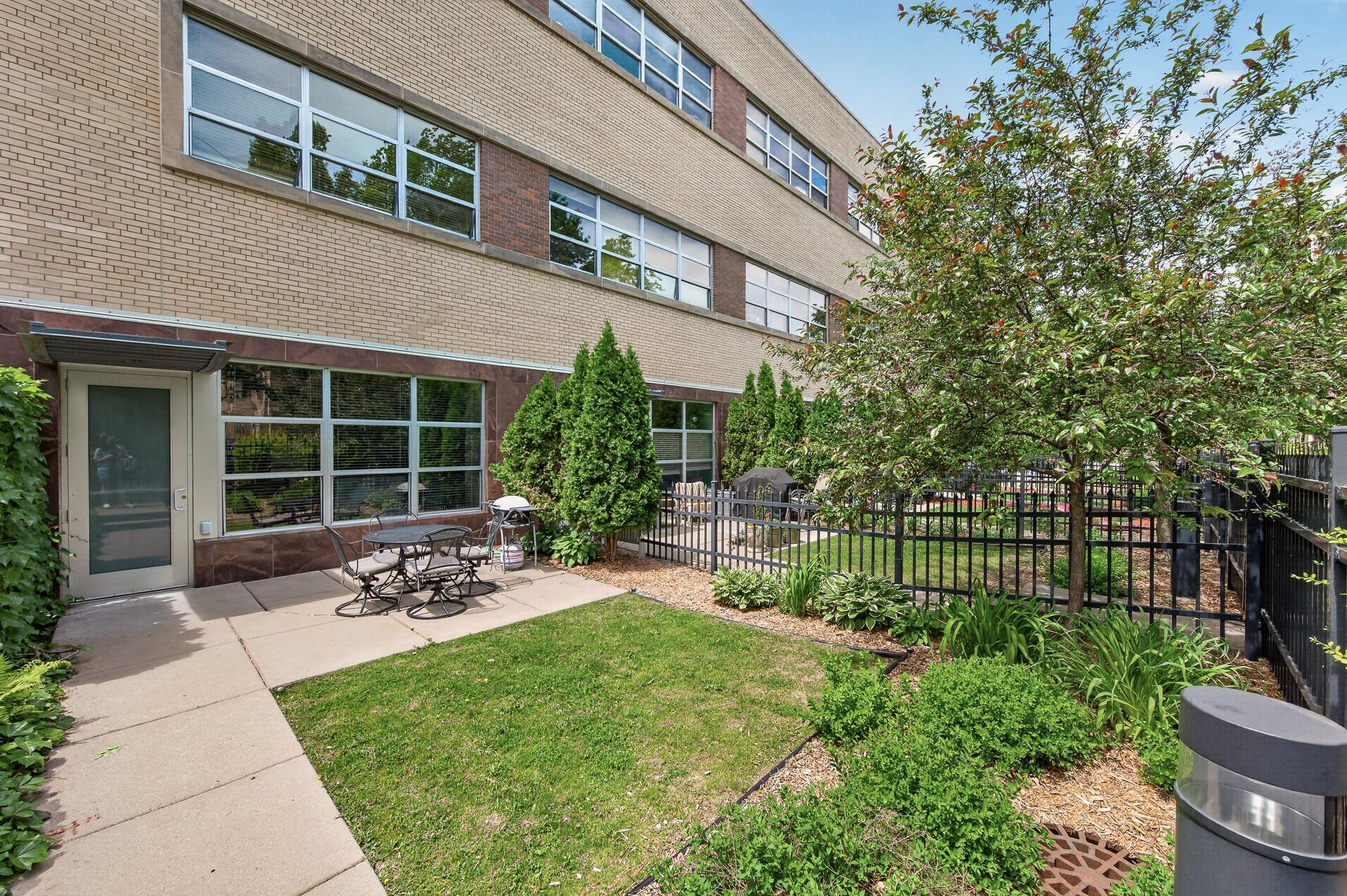 Views of the private patio showcasing the landscaping as you enter through the secured and private gate.