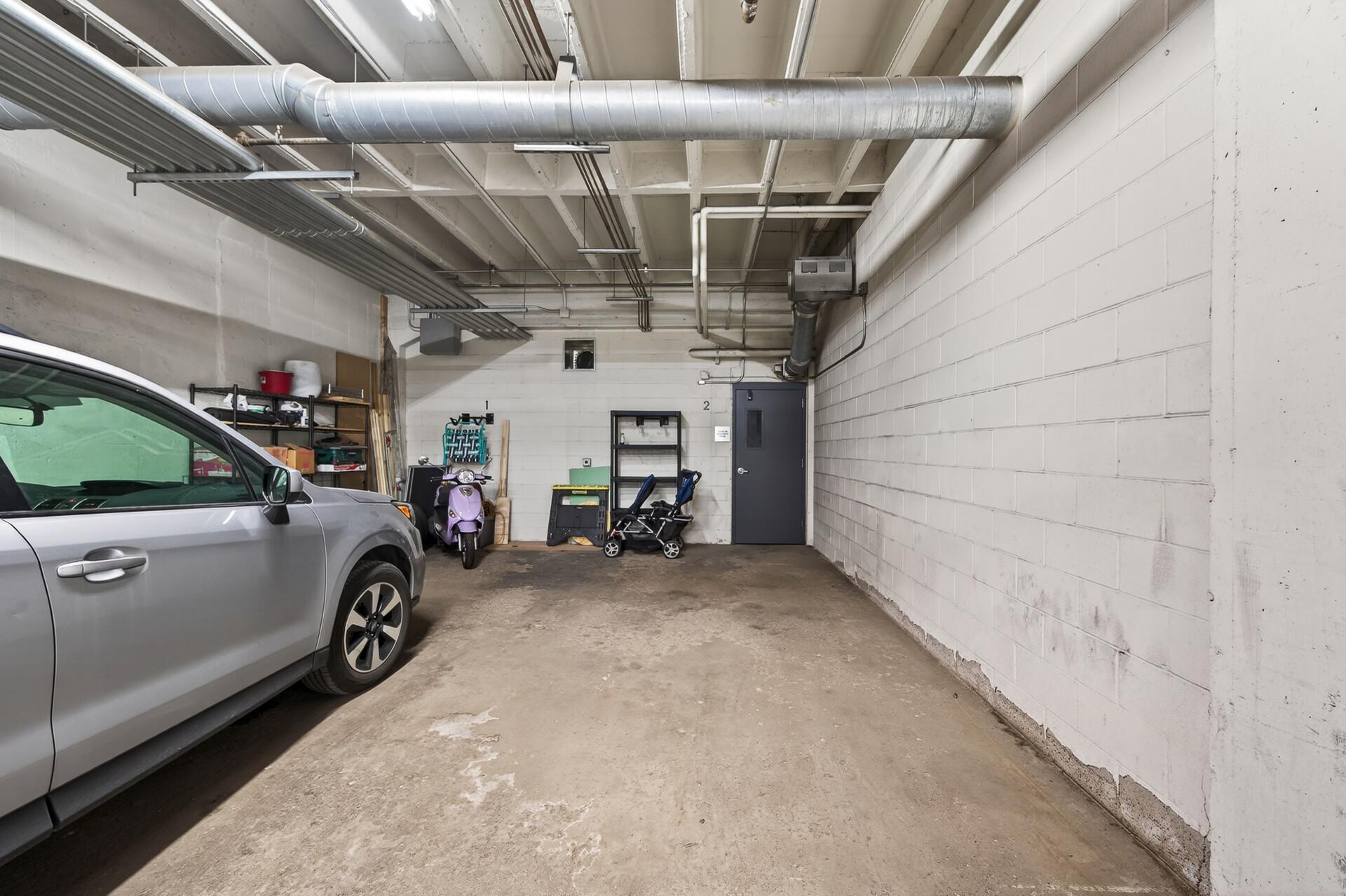 One of two indoor assigned parking spaces with extra deep bay.