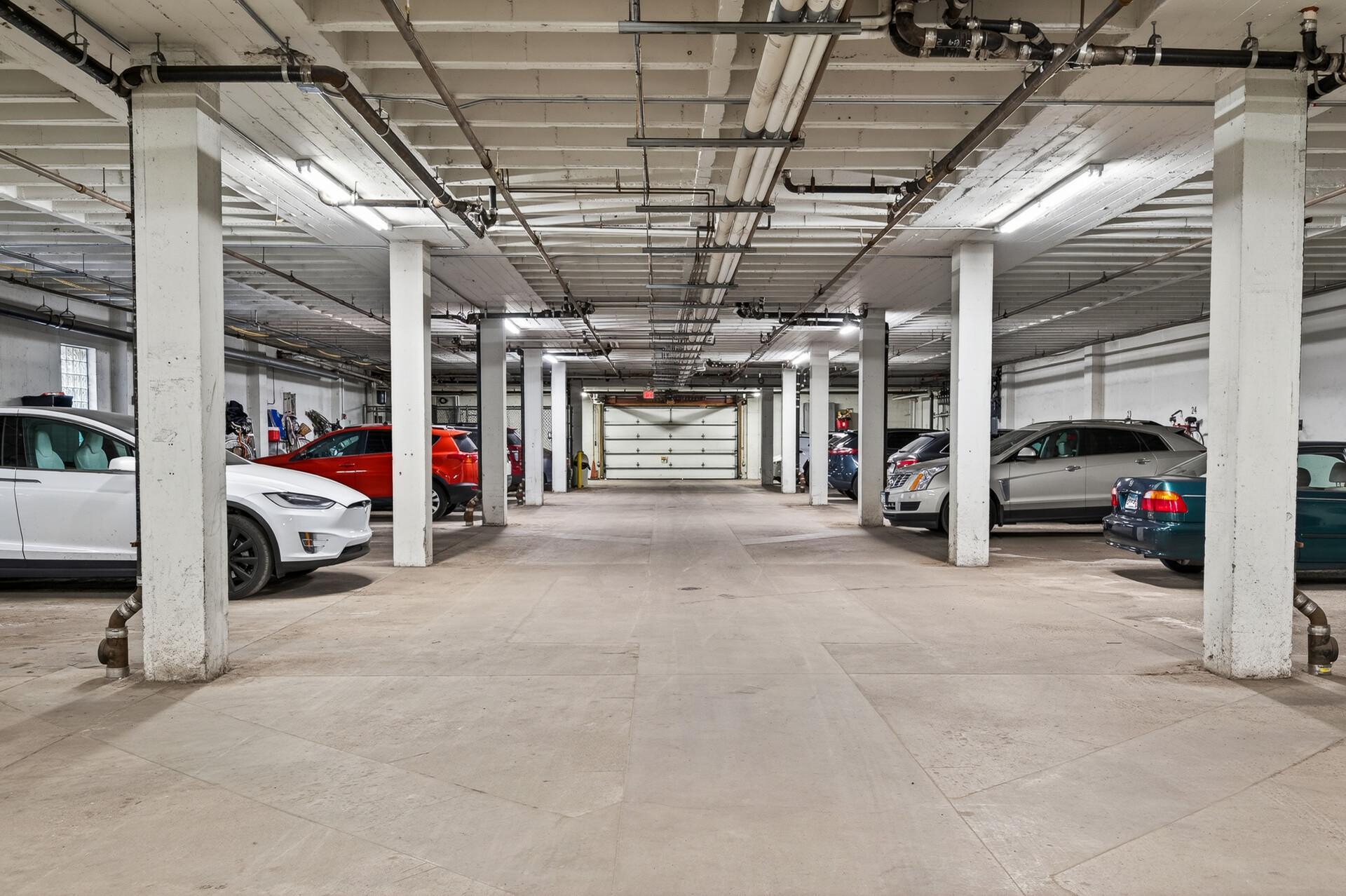 Views of clean, well lit, and secured garage.