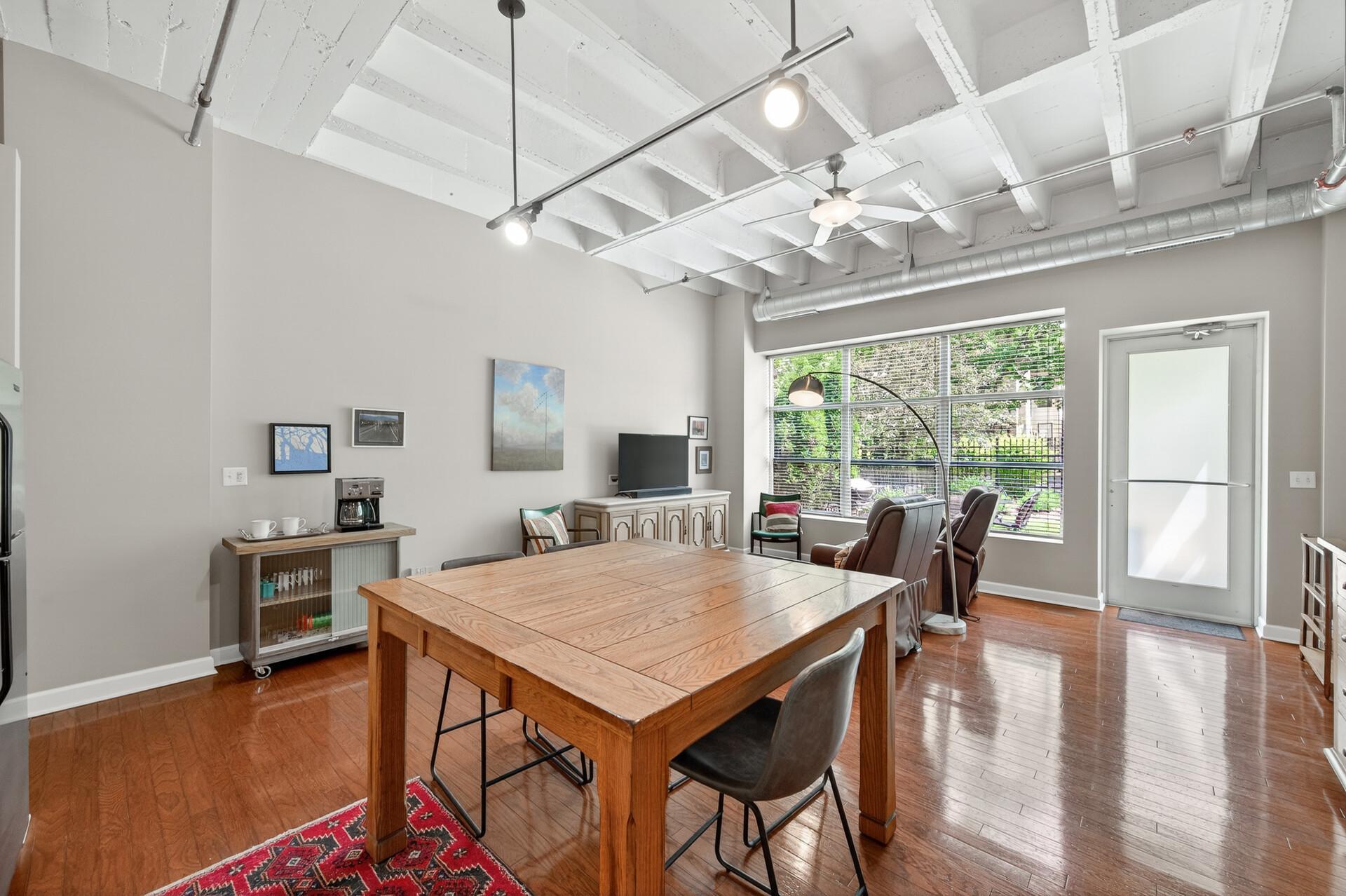 Standing in the kitchen looking out at the living space and views of the outdoor patio.