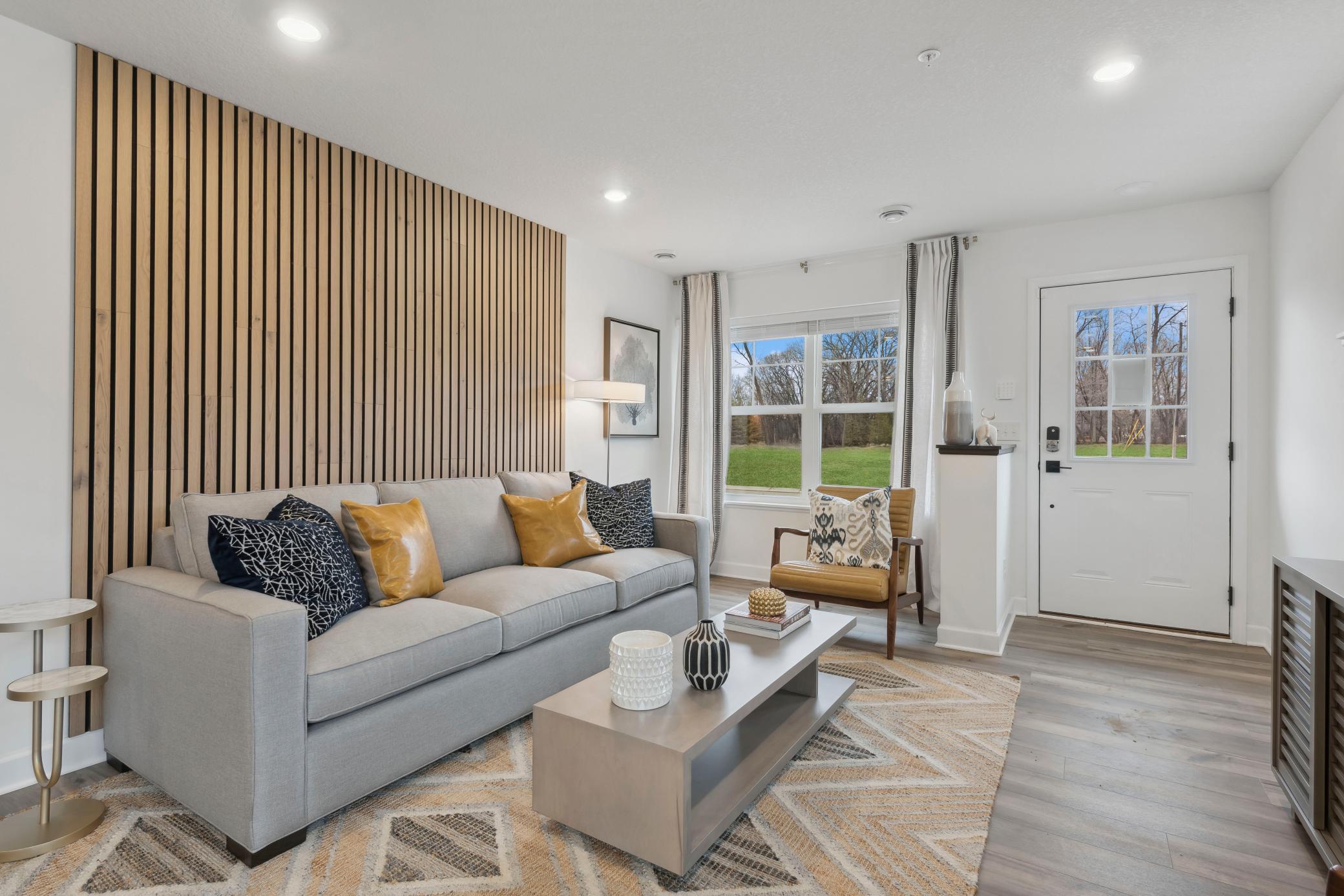 (Photo of decorated model, actual home's finishes vary) Notice the stunning natural light pouring into the family room.