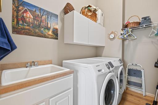 Main floor laundry with sink & cabinets!