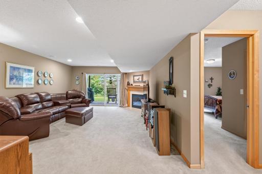Large family room with corner fireplace.