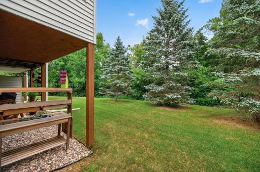 The backyard is wooded and private!