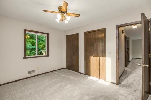 This upper level bedroom comes with double closets