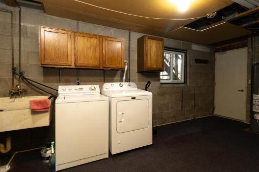 Clean laundry area with ample storage space