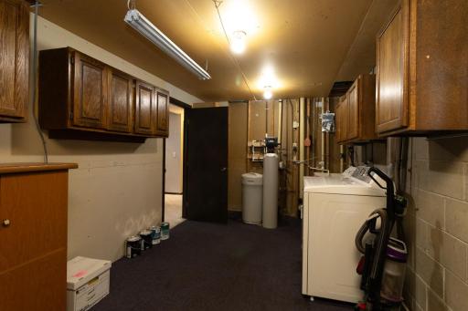 Convenient cabinets line both walls of your clean utility room