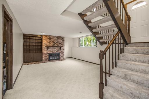 Head downstairs for cozy quality time in the lower level family room (fireplace for ambiance only - non-functioning - please see seller's disclosure)