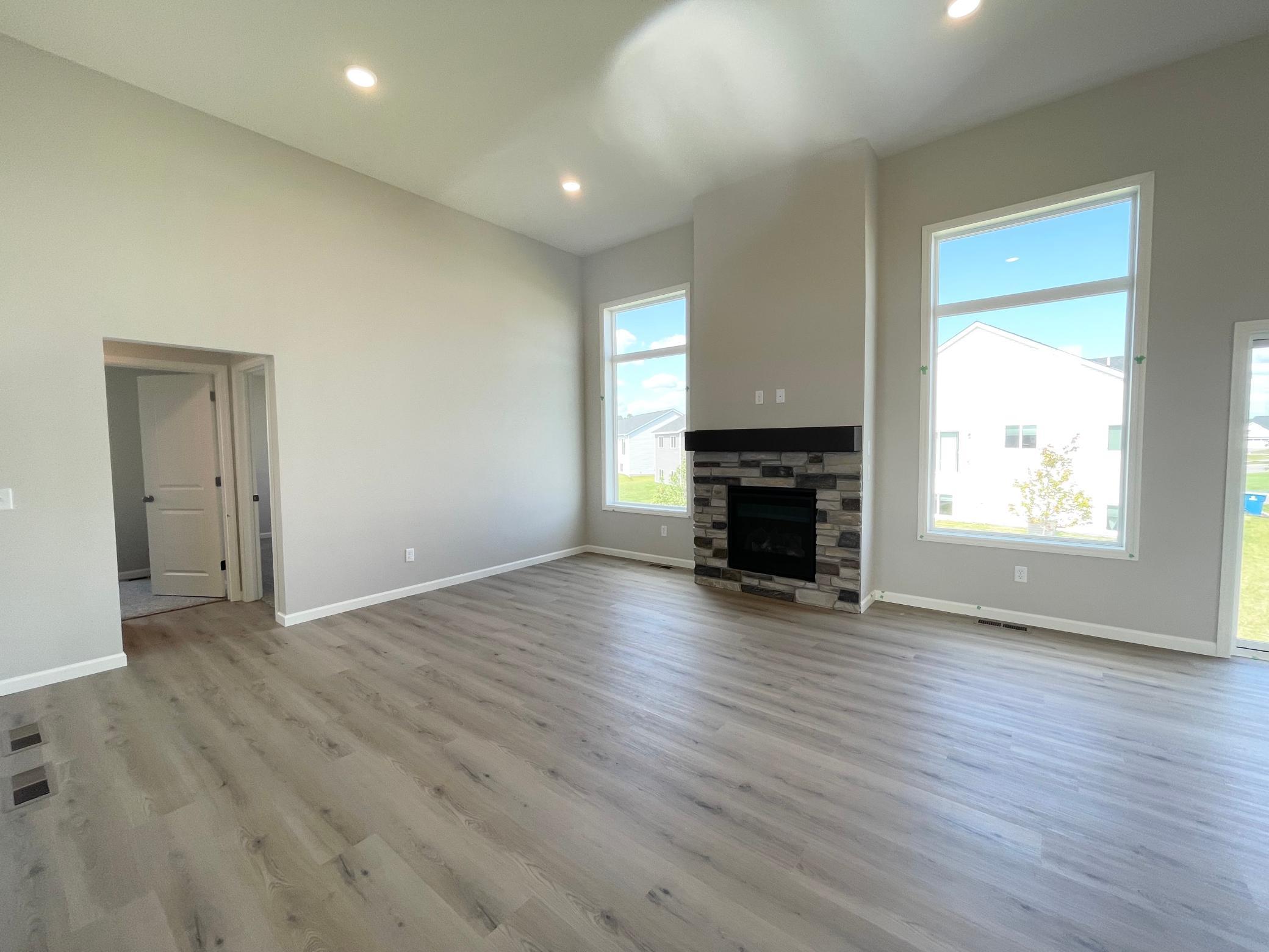 Actual home will have fireplace in basement, no stone. Photo shows the same floor plan but not the actual home. Photos of actual home will be uploaded when home has been completed and cleaned.