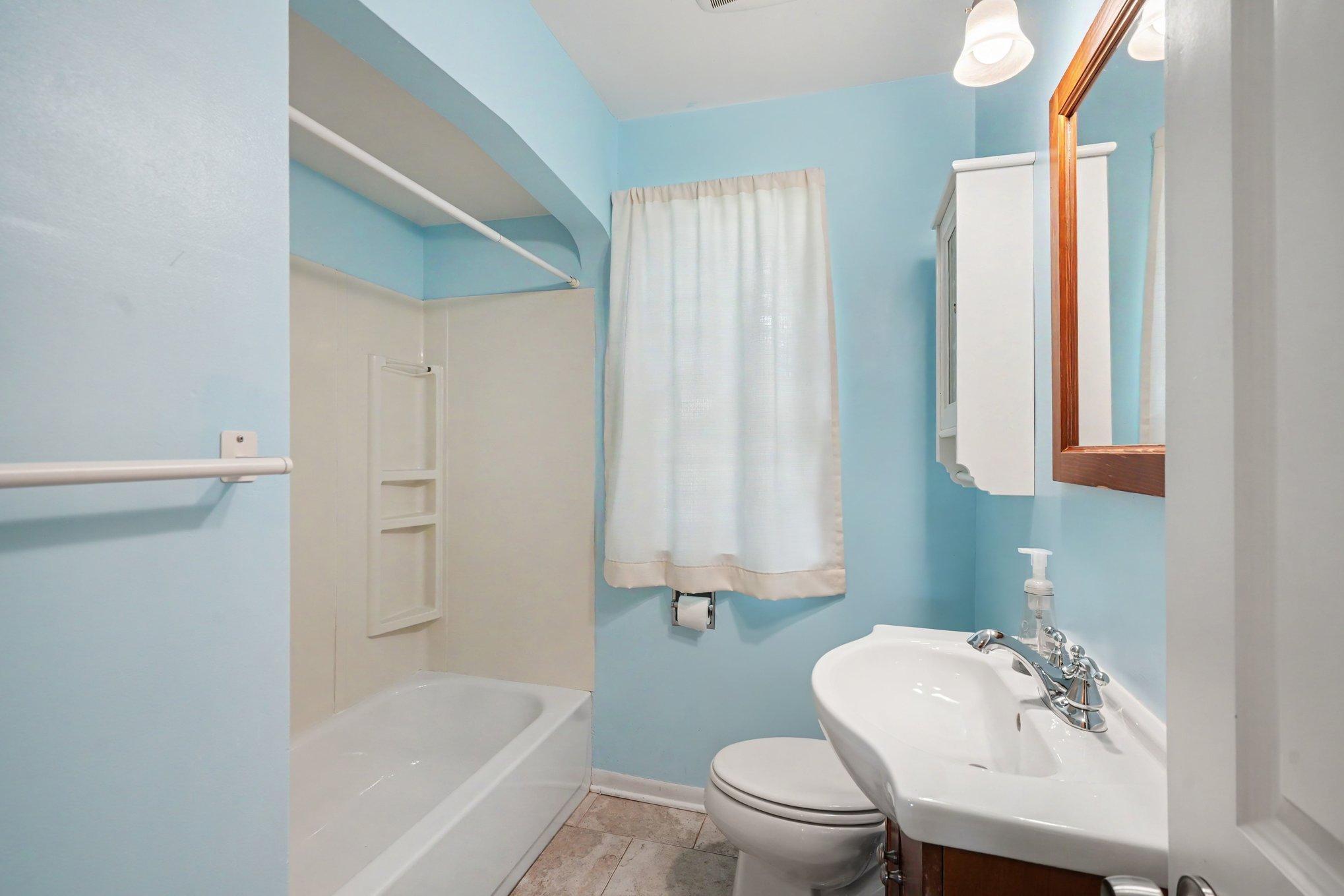 Updated main floor full bathroom, ceramic tile floor & freshly painted.