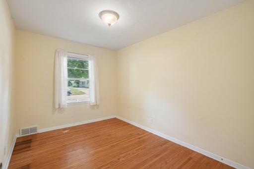 2nd bedroom with hardwood floors & fresh paint, ready to move in!