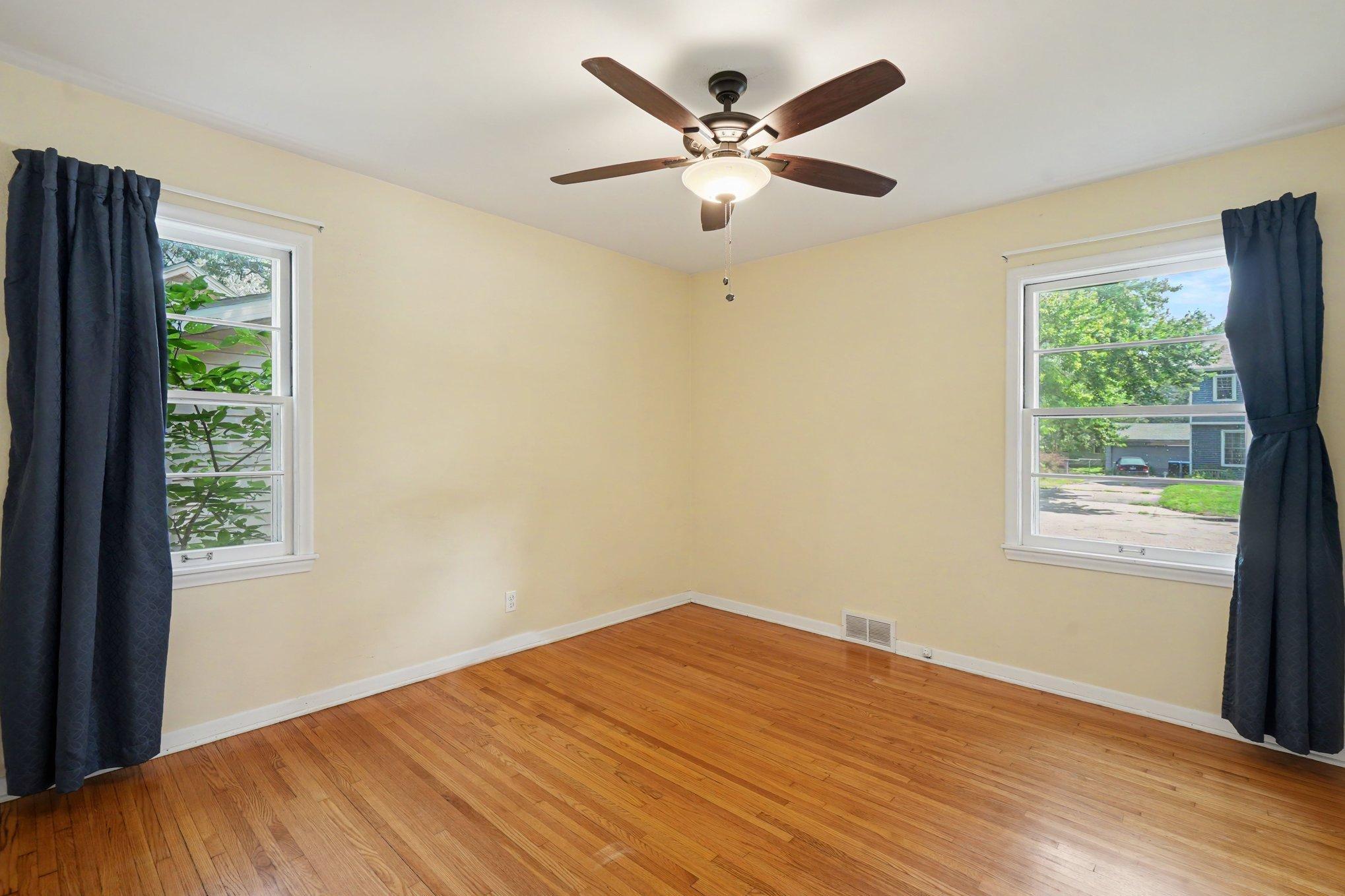 One of the main floor bedrooms with great natural light, beautiful wood floors & freshly painted. This room is large enough for a king-sized bed.