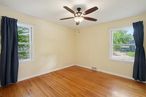 One of the main floor bedrooms with great natural light, beautiful wood floors & freshly painted. This room is large enough for a king-sized bed.