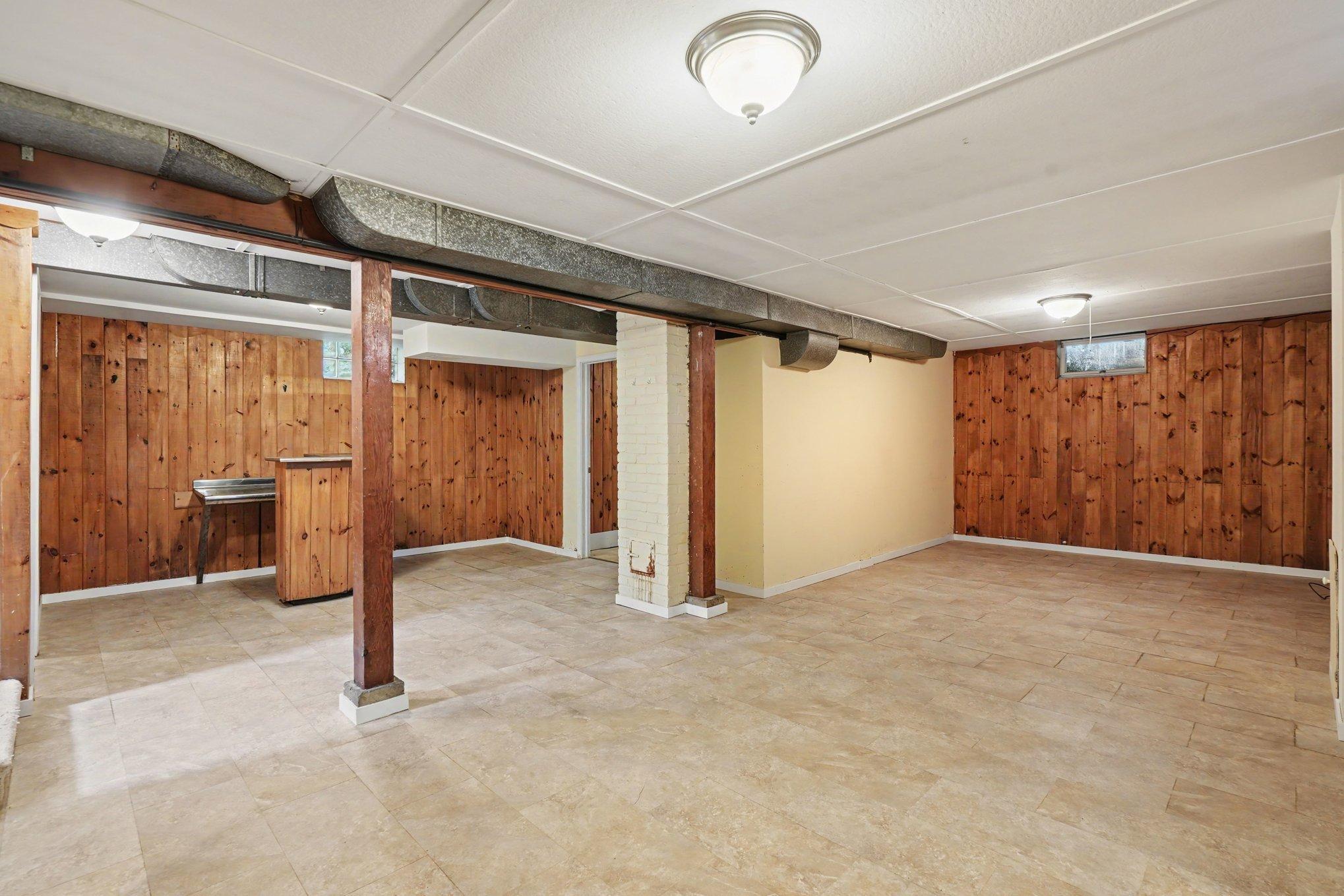 Finished lower level boasts newer flooring and timeless knotty pine accents. Built-in bar creating a great setup for hosting game days & gatherings. Very versatile flex space that could accommodate a home theater, gym, or playroom.
