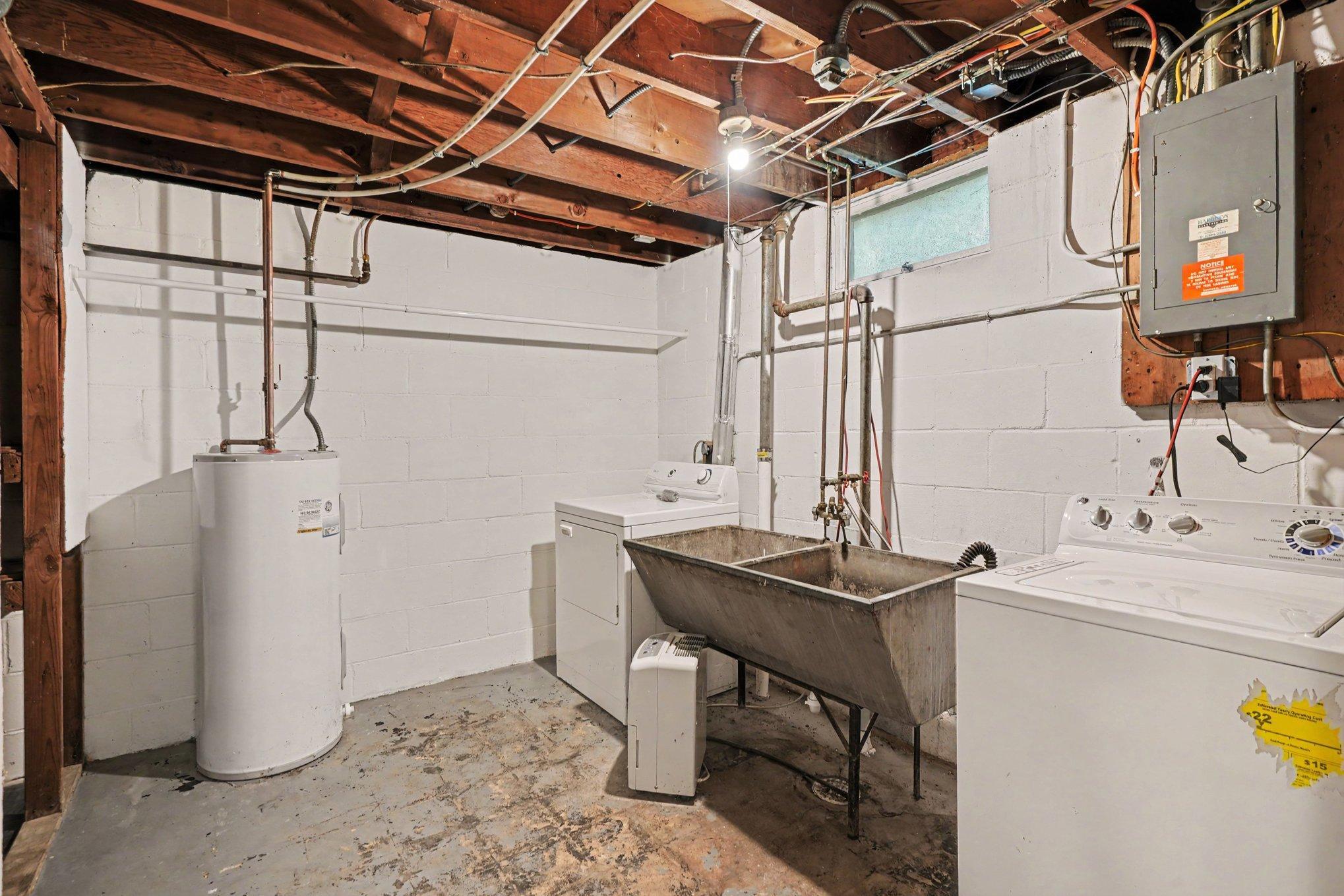 Laundry room with under the stairs storage