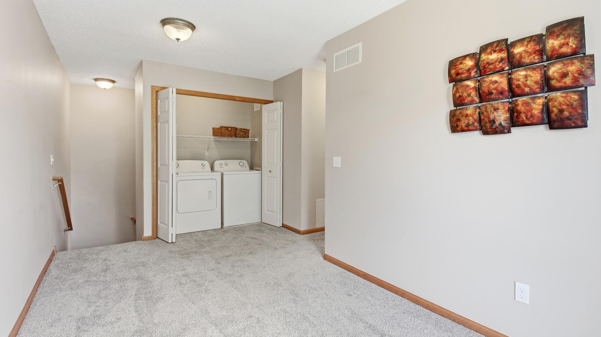 The handy upper-level laundry - and, of course, another view of the new carpet.