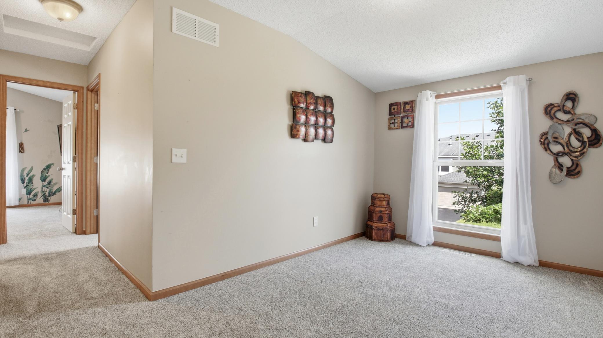 Another view of the loft and the hallway to the bedrooms and bathroom.