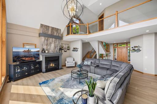 Vaulted living room with show stopping chandelier