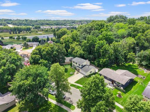 Surrounded by mature trees and established landscaping, the setting feels tucked away while still being just minutes from Rochester Golf & Country Club, Cascade Creek, parks, lakes, and Harriet Bishop Elementary.
