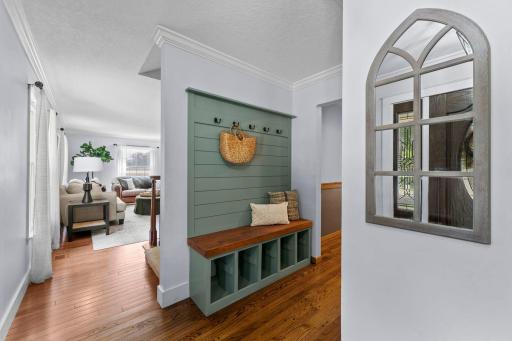 Complete with built-in bench seating, coat hooks and crown molding.