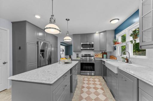 Enjoy a center island for additional prep space and durable tile flooring.