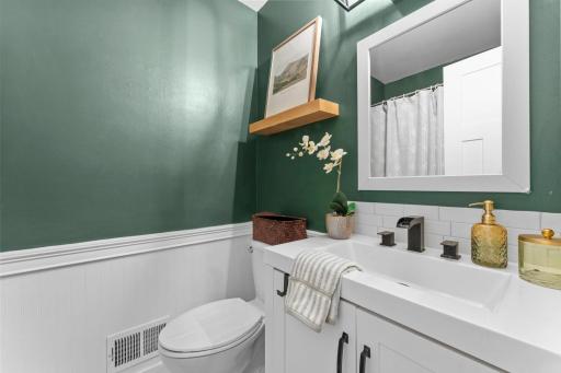 A shared full bath and additional hallway storage complete the upper level.