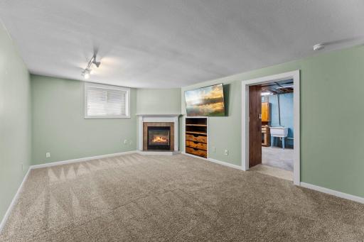 The lower level adds yet another place to gather with a spacious rec room anchored by a gas fireplace.