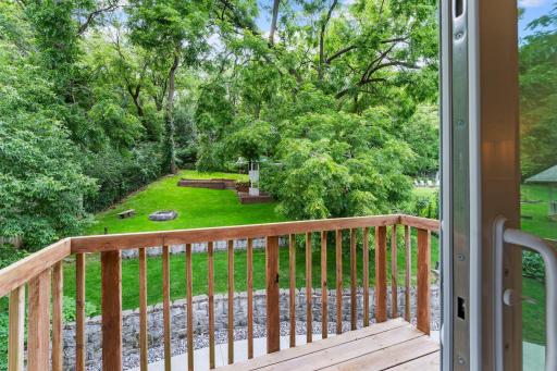 Private balcony overlooking the backyard, a peaceful spot where the only view is trees and open green space!