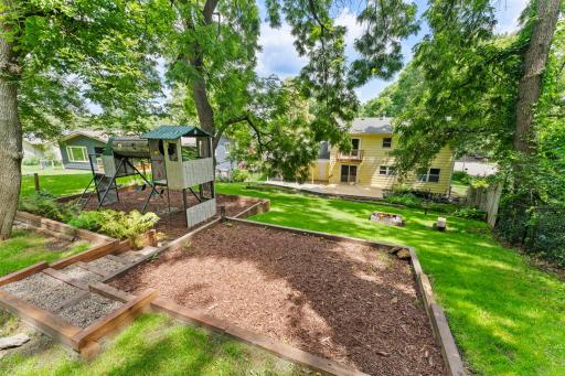 Raspberry bushes flourish alongside the courtyard, while the peaceful setting regularly attracts deer, wild turkeys, and rabbits, creating a backyard that's as beautiful as it is alive with nature.