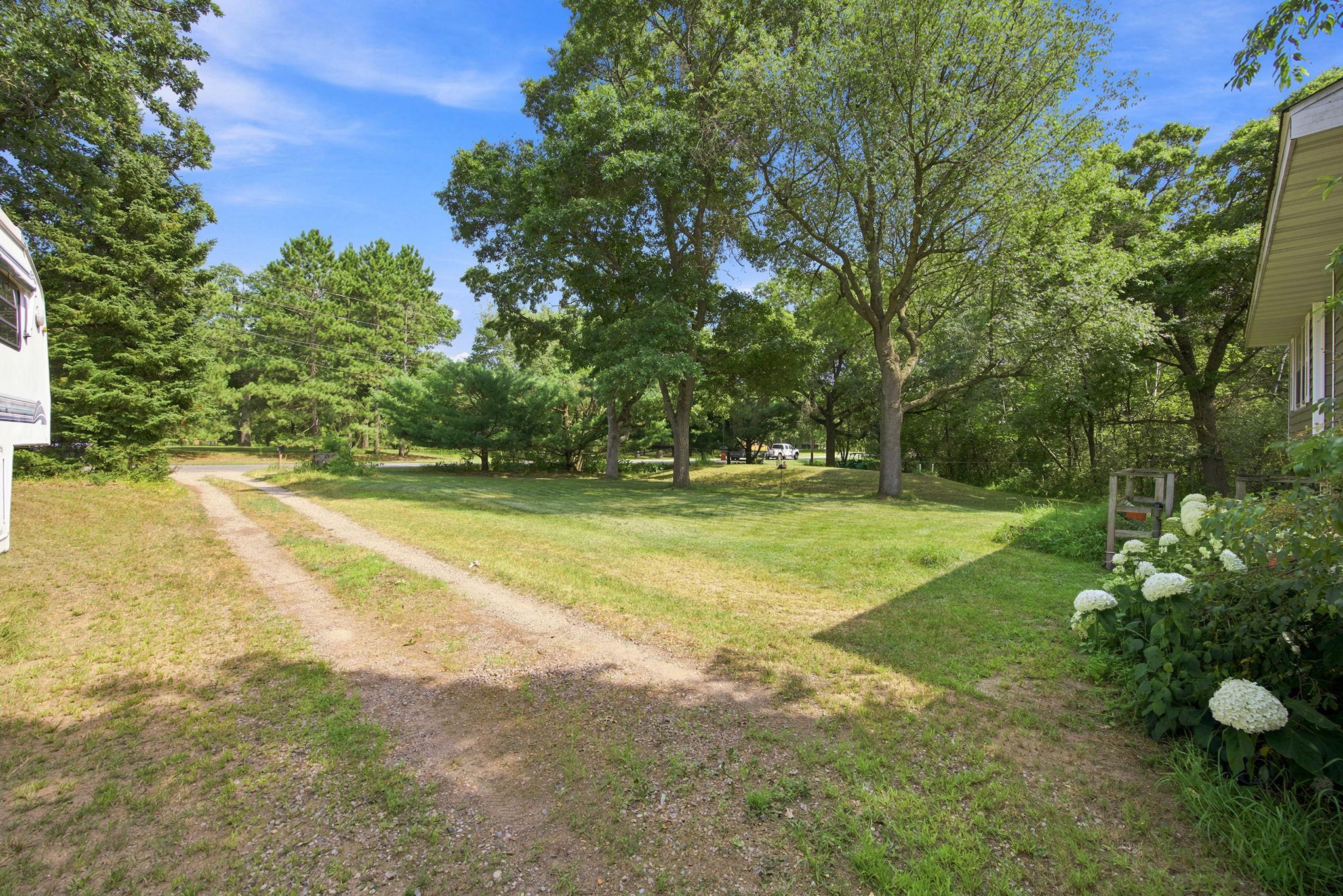 A generous lot with a long driveway and plenty of outdoor space.
