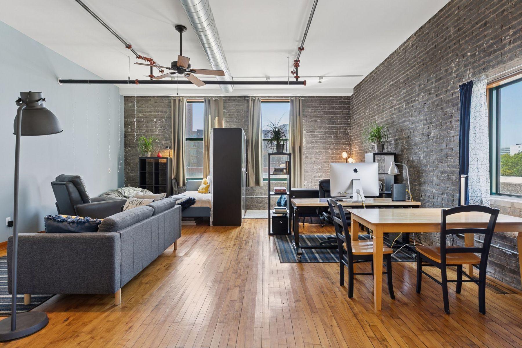 Brick walls, large windows, and abundant natural light