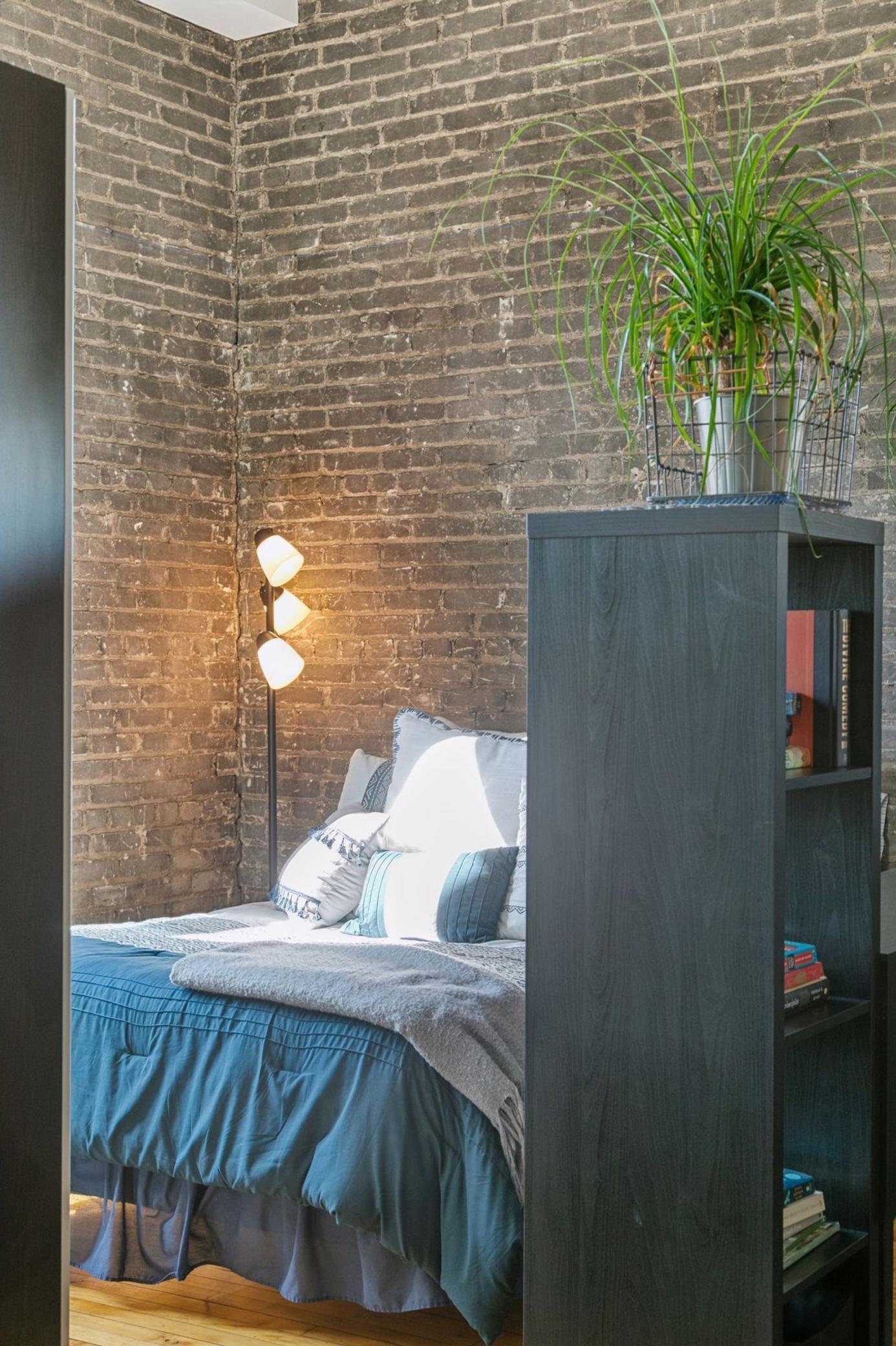 Exposed brick, hardwood floors, and thoughtful lighting — quality features rarely found at this price point.