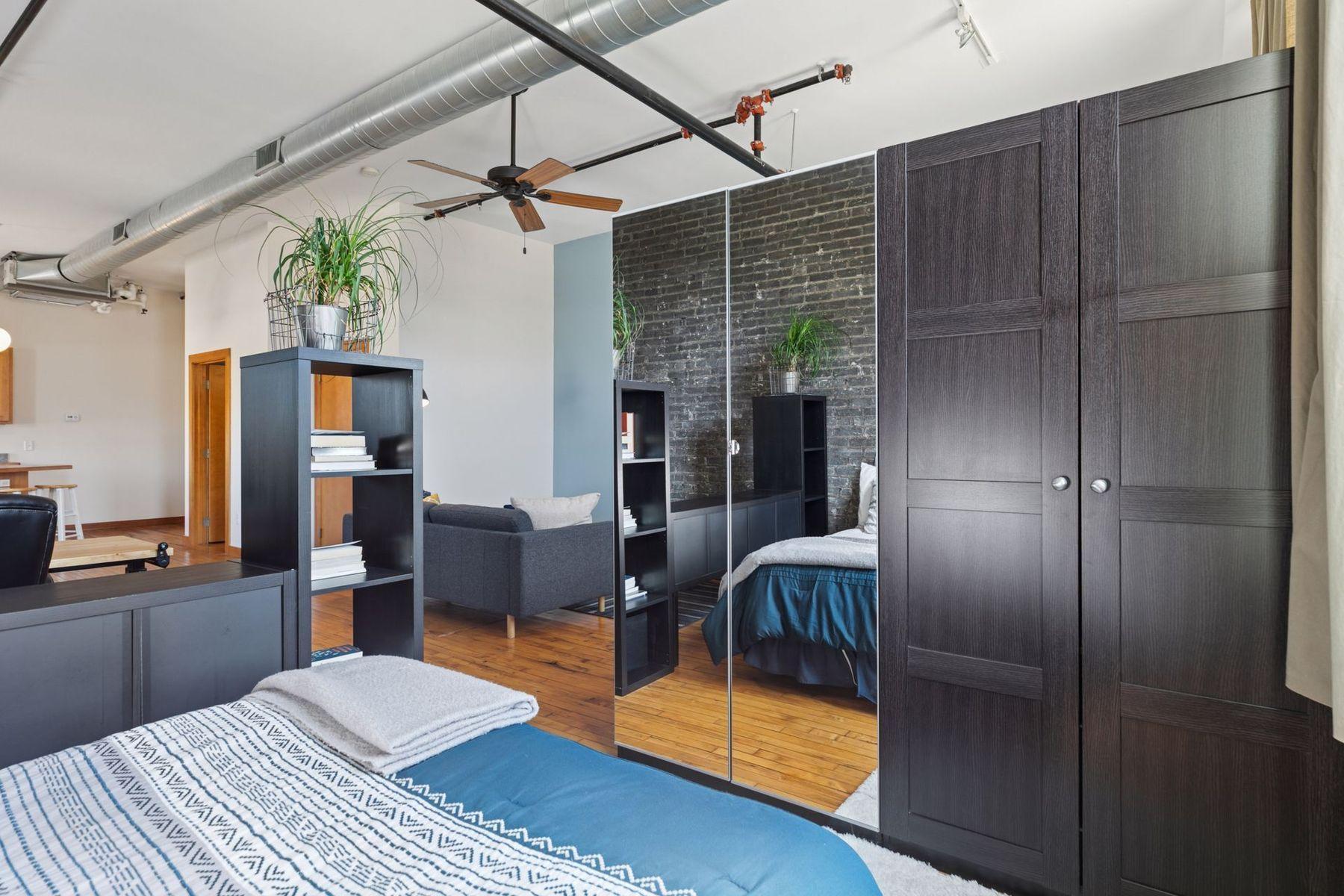 Built-in wardrobes and room dividers provide separation, storage, and flexibility without closing off the space.