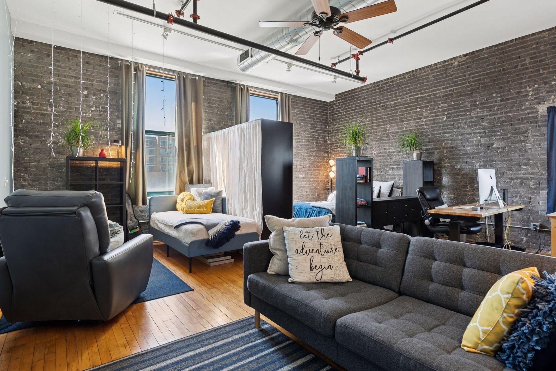 Available fully furnished(optional) — move in this weekend. Exposed brick, hardwood floors, and industrial ceiling details.