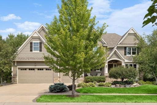 The home includes an oversized 3-car finished & heated garage with a soaring 11'8" ceiling. Features include a workbench with cabinets, hot/cold water hose, floor drain, central vacuum, ski racks and two 150-amp electrical panels.