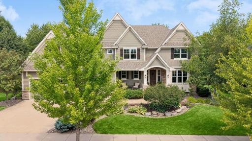 Mature trees & lush landscaping create stunning curb appeal. Enjoy Hardie board siding, stone accents, low-voltage lighting & a spacious stamped concrete patio for outdoor living. The roof was replaced in 2022.