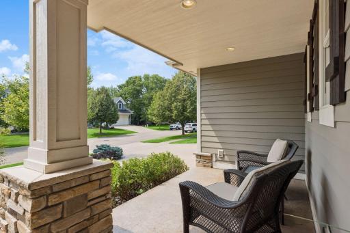 Unwind on the covered front stamped concrete patio. Built-in outlets make holiday lights effortless, with the switch conveniently tucked in the mudroom closet.