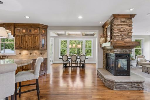 View of the home layout between the kitchen, dining room and living room.