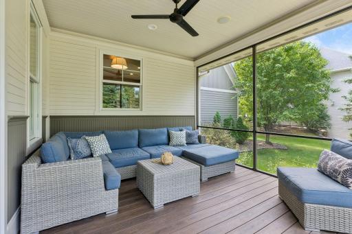 Enjoy a beautfiul day on the screened porch with maintenance-free deck boards, shiplap and a ceiling fan.