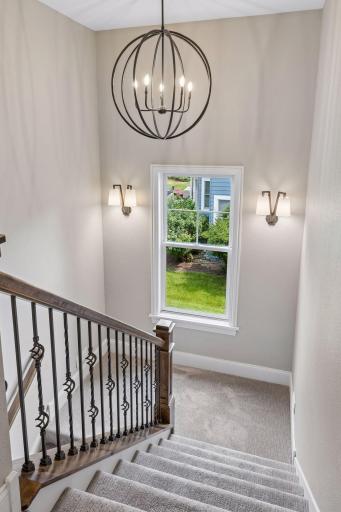 Both landings to the upper level and lower level include a large window to lots of natural light.