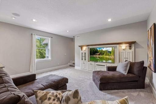 The additional family room includes a convenient built-in entertainment center with storage.