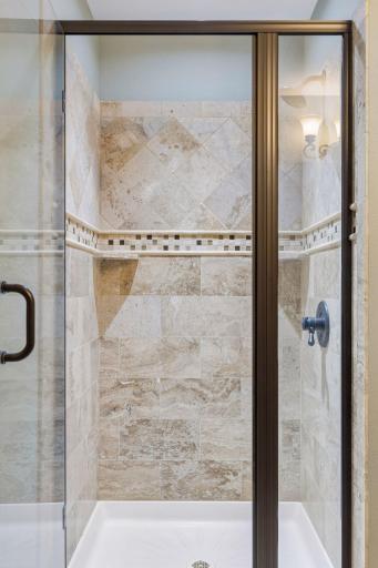 View of the 3/4 shower with ceramic tile surround.